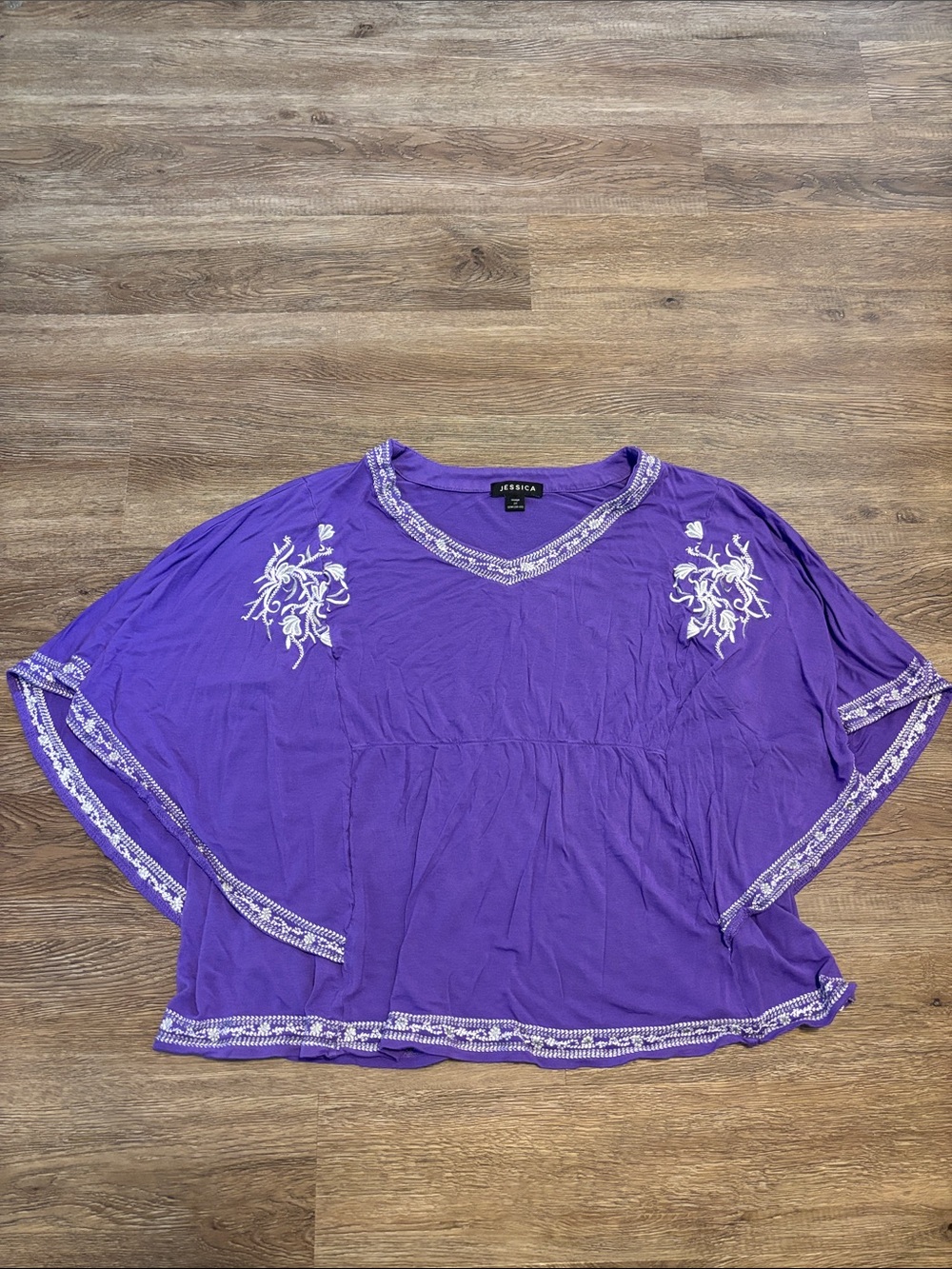 women’s purple and white poncho style top